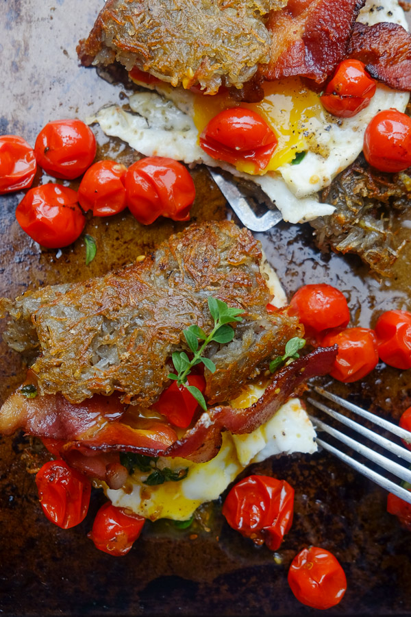 Hash Brown Omelet! A new take on breakfast. Inside you'll find fried eggs, tomatoes with oregano and bacon. Recipe on Shutterbean.com