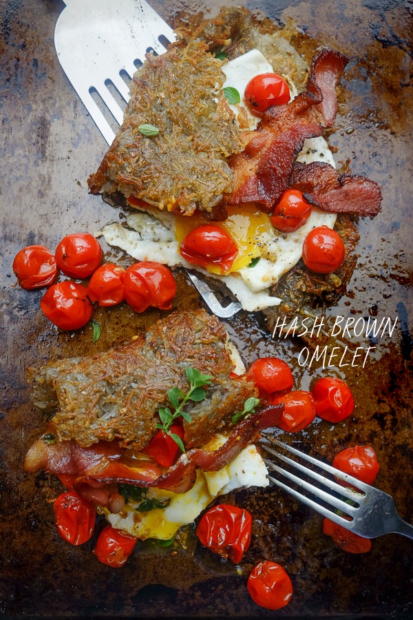 Hash Brown Omelet! A new take on breakfast. Inside you'll find fried eggs, tomatoes with oregano and bacon. Recipe on Shutterbean.com