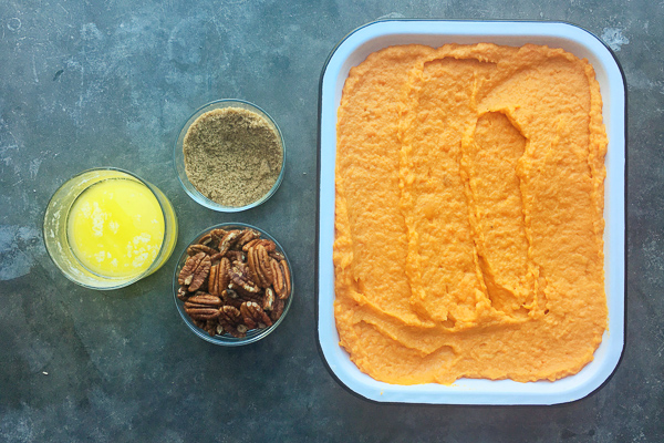 Pecan Topped Sweet Potatoes for a traditional Thanksgiving Feast! Find the recipe on Shutterbean.com