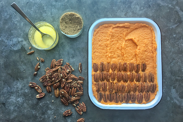 Pecan Topped Sweet Potatoes for a traditional Thanksgiving Feast! Find the recipe on Shutterbean.com