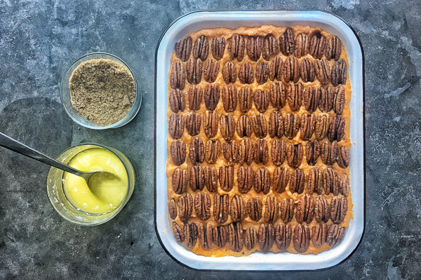 Pecan Topped Sweet Potatoes for a traditional Thanksgiving Feast! Find the recipe on Shutterbean.com