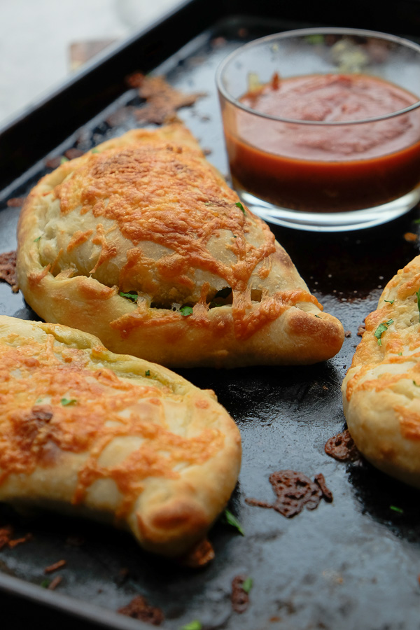 If you're looking for a great vegetarian weeknight meal, check out this Spinach Artichoke Calzone recipe on Shutterbean.com!