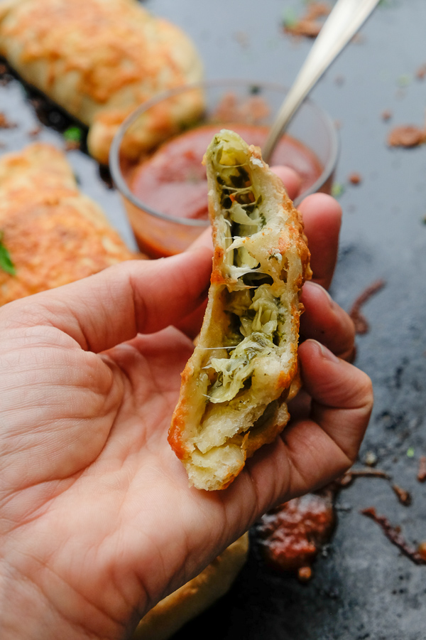 If you're looking for a great vegetarian weeknight meal, check out this Spinach Artichoke Calzone recipe on Shutterbean.com!