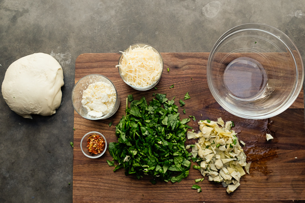 If you're looking for a great vegetarian weeknight meal, check out this Spinach Artichoke Calzone recipe on Shutterbean.com!