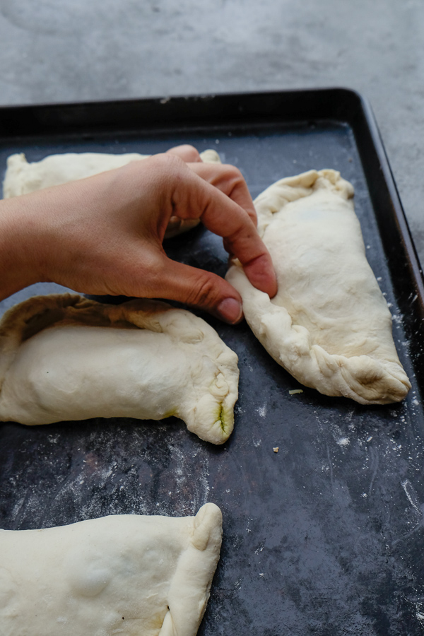 If you're looking for a great vegetarian weeknight meal, check out this Spinach Artichoke Calzone recipe on Shutterbean.com!