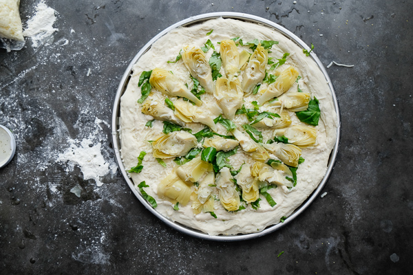 A few items from Trader Joe's and you have yourself Creamy Artichoke Pizza. Find the recipe on Shutterbean.com!