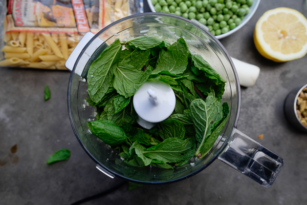 Celebrate Spring goodness with a bowl of Penne with Pistachio Mint Pesto. Find the recipe on Shutterbean.com