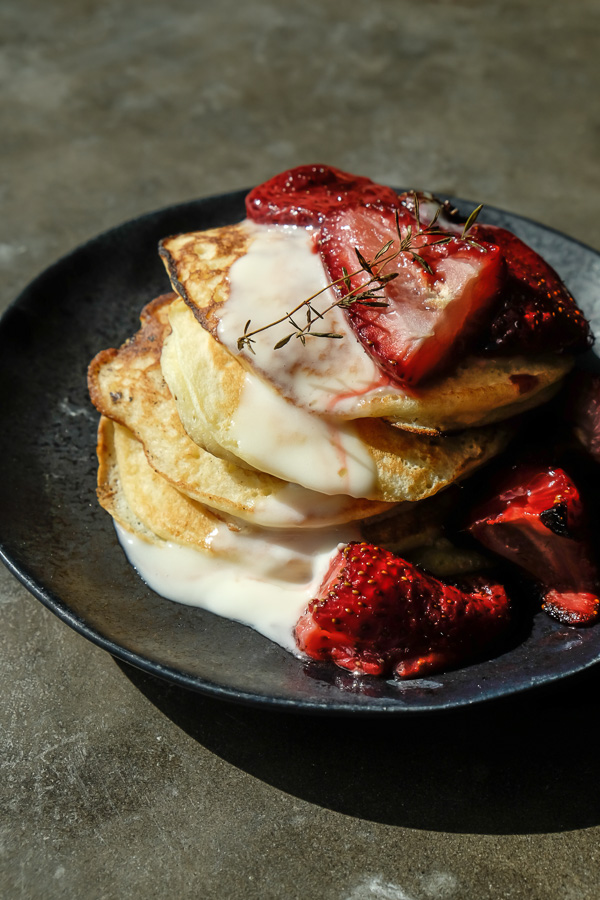 Light and Fluffy Ricotta Pancakes with Roasted Strawberries- find the recipe on Shutterbean.com!