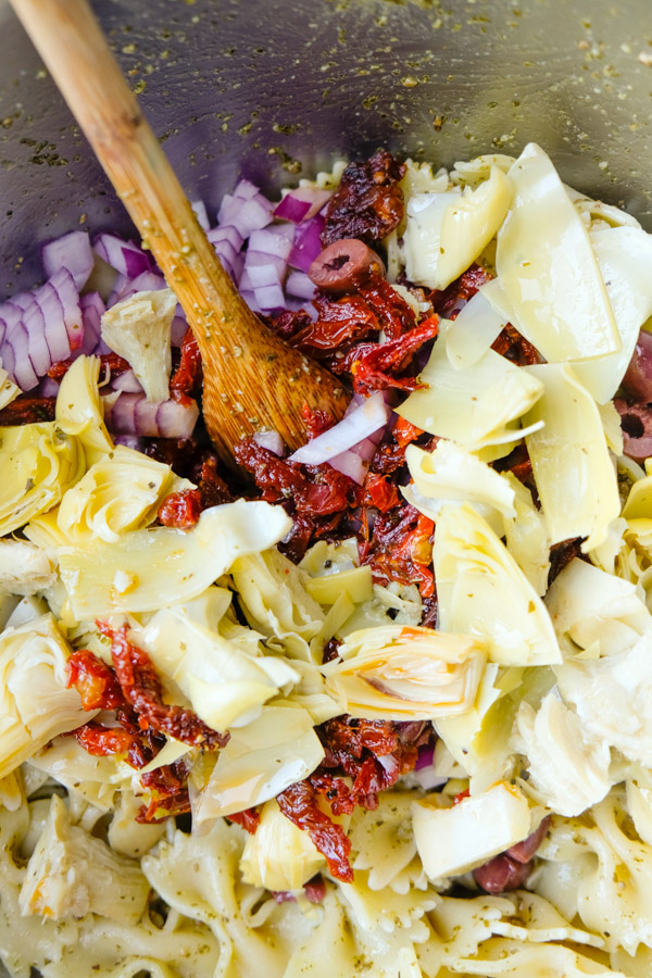 Mediterranean Pasta Salad is a weekly staple. Perfect for work lunches paired with extra greens. Find the recipe on Shutterbean.com