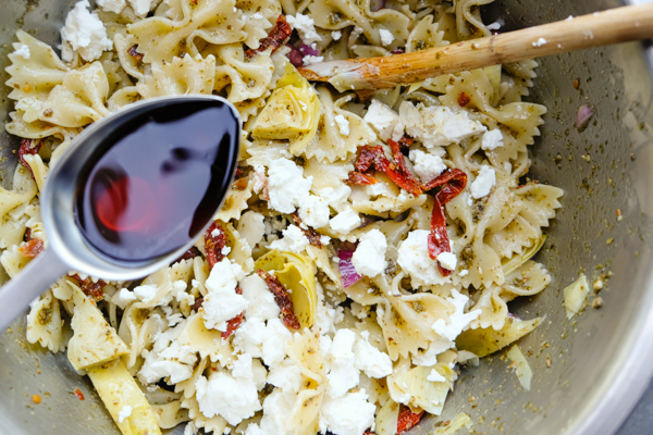 Mediterranean Pasta Salad is a weekly staple. Perfect for work lunches paired with extra greens. Find the recipe on Shutterbean.com