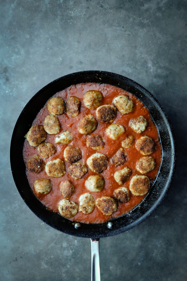 Combine the flavors of Chicken Parmesan with meatballs with this Chicken Parmesan Meatball dish! Find the recipe on Shutterbean.com