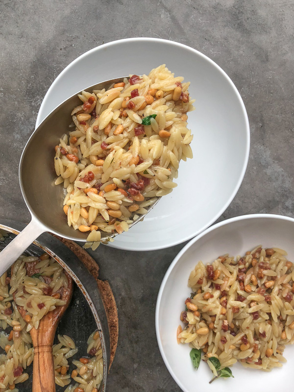 Orzo with Pancetta and Pine Nuts - a delicious/easy to prepare dinner! Find the recipe on Shutterbean.com