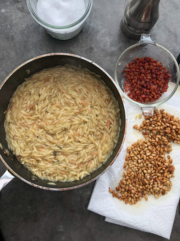 Orzo with Pancetta and Pine Nuts - a delicious/easy to prepare dinner! Find the recipe on Shutterbean.com