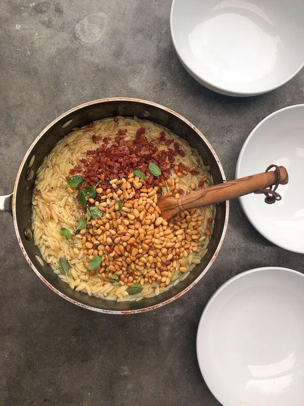 Orzo with Pancetta and Pine Nuts - a delicious/easy to prepare dinner! Find the recipe on Shutterbean.com