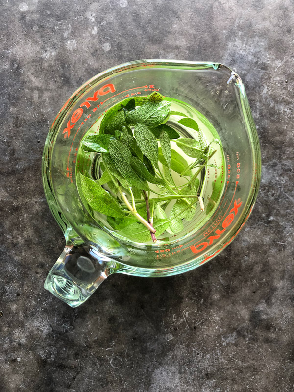 Bourbon Sage Cooler- a refreshing cocktail with just the right amount of sweetness. Find the recipe on Shutterbean.com in partnership with Nugget Markets!