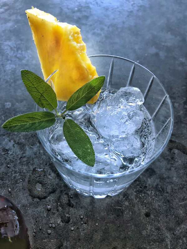 Bourbon Sage Cooler- a refreshing cocktail with just the right amount of sweetness. Find the recipe on Shutterbean.com in partnership with Nugget Markets!