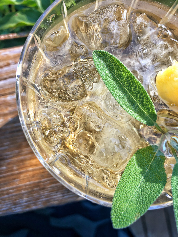 Bourbon Sage Cooler- a refreshing cocktail with just the right amount of sweetness. Find the recipe on Shutterbean.com in partnership with Nugget Markets!