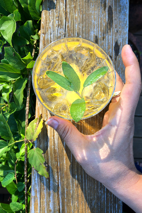 Bourbon Sage Cooler- a refreshing cocktail with just the right amount of sweetness. Find the recipe on Shutterbean.com in partnership with Nugget Markets!