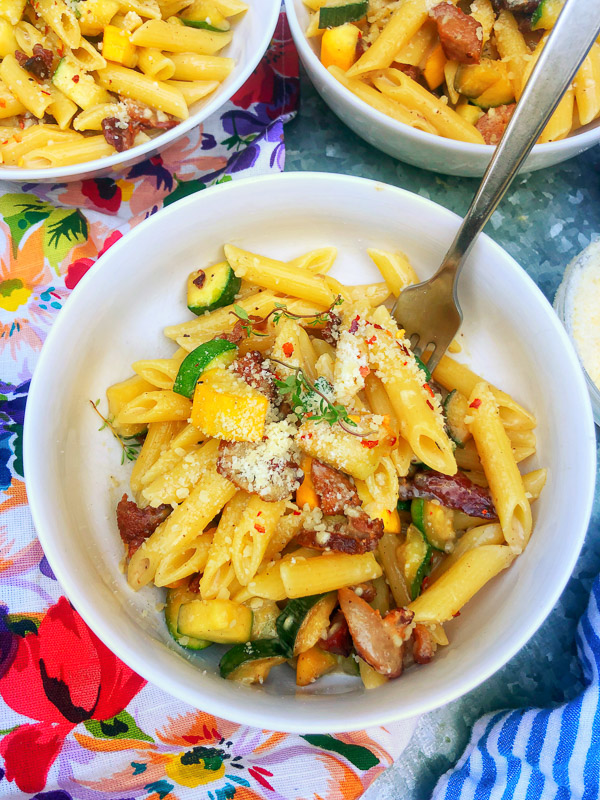 Creamy Zucchini Carbonara made with fresh zucchini and crispy bacon! Find the recipe on Shutterbean.com