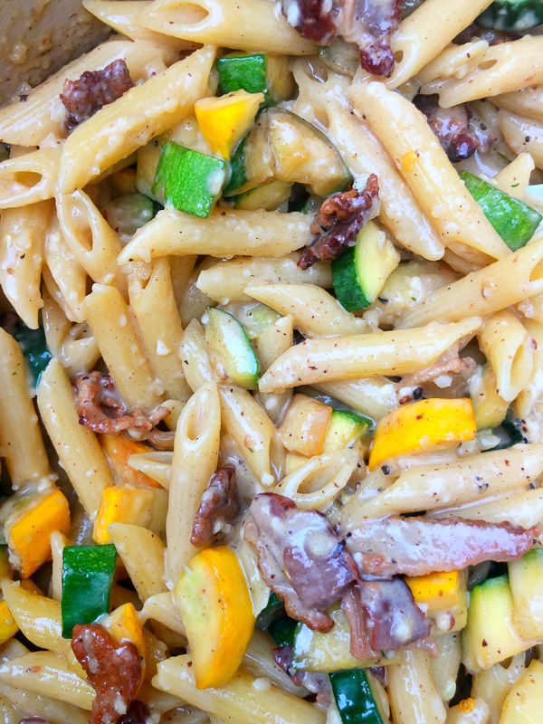 Creamy Zucchini Carbonara made with fresh zucchini and crispy bacon! Find the recipe on Shutterbean.com