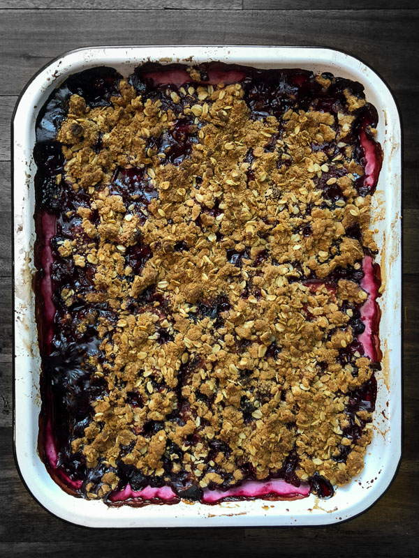 Simple Mixed Berry Crumble with whipped cream is a wonderful summer dessert. Find the recipe on Shutterbean.com!