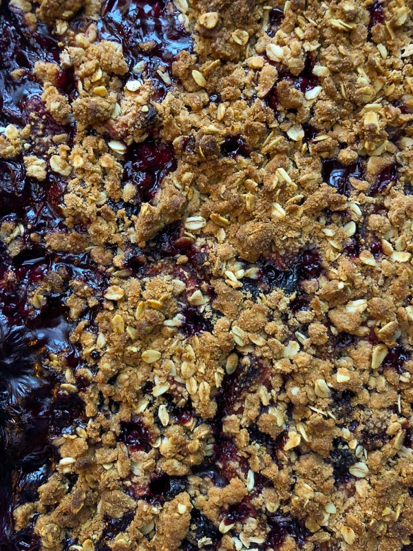 Simple Mixed Berry Crumble with whipped cream is a wonderful summer dessert. Find the recipe on Shutterbean.com!