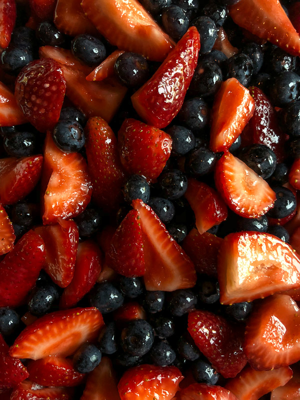 Simple Mixed Berry Crumble with whipped cream is a wonderful summer dessert. Find the recipe on Shutterbean.com!