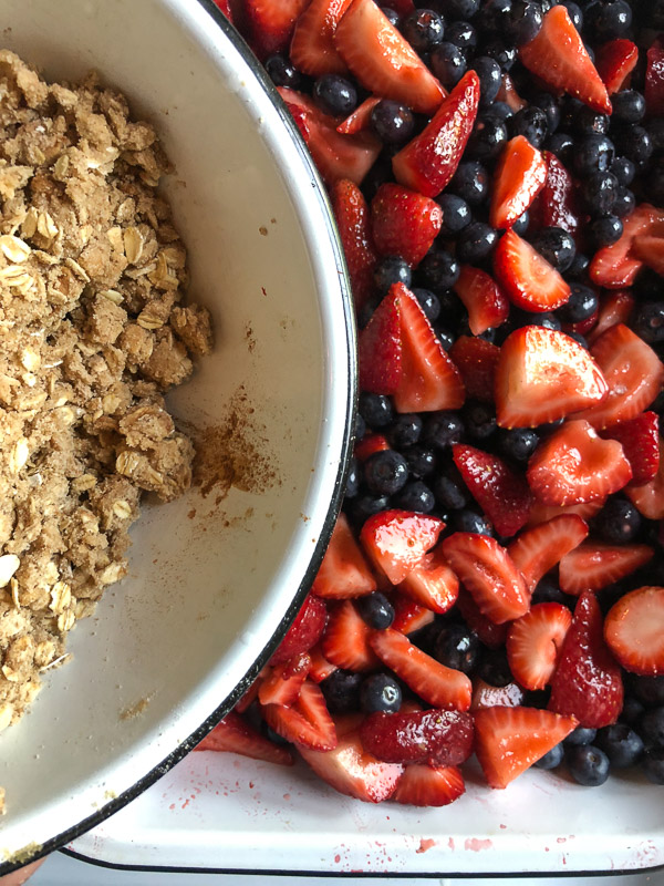 Simple Mixed Berry Crumble with whipped cream is a wonderful summer dessert. Find the recipe on Shutterbean.com!