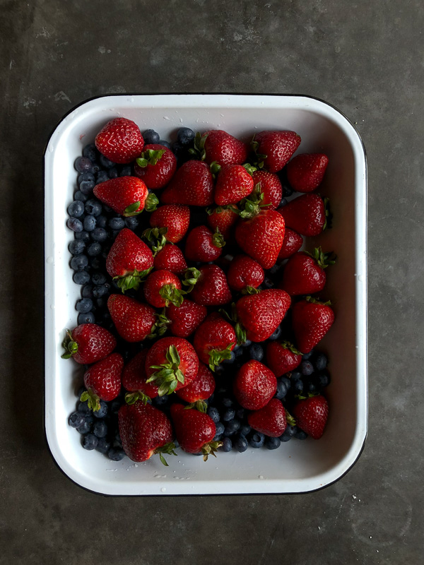 Simple Mixed Berry Crumble with whipped cream is a wonderful summer dessert. Find the recipe on Shutterbean.com!