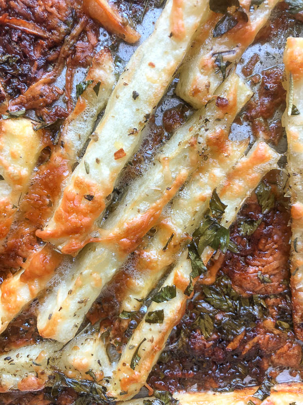 Want to impress dinner guests? Make these crispy Italian Fries! A combination of melted cheese and Italian herbs will level up your baked oven fry game. Recipe on Shutterbean.com!