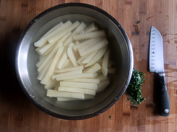 Want to impress dinner guests? Make these crispy Italian Fries! A combination of melted cheese and Italian herbs will level up your baked oven fry game. Recipe on Shutterbean.com!