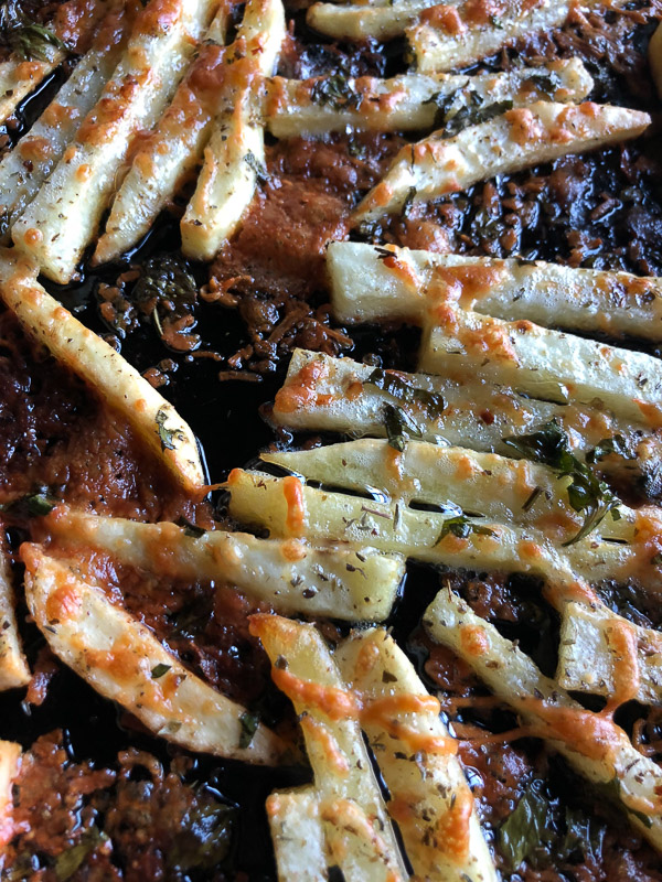 Want to impress dinner guests? Make these crispy Italian Fries! A combination of melted cheese and Italian herbs will level up your baked oven fry game. Recipe on Shutterbean.com!