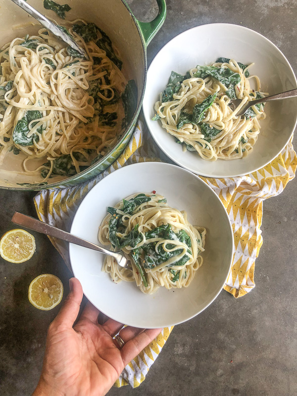 Creamy Goat Cheese and Spinach Pasta is a snap to put together on a weeknight. The sauce is made creamy with goat cheese and pasta water. Recipe on Shutterbean.com!