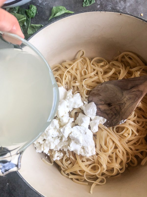 Creamy Goat Cheese and Spinach Pasta is a snap to put together on a weeknight. The sauce is made creamy with goat cheese and pasta water. Recipe on Shutterbean.com!