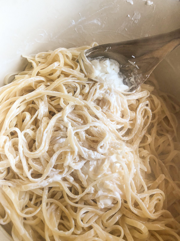 Creamy Goat Cheese and Spinach Pasta is a snap to put together on a weeknight. The sauce is made creamy with goat cheese and pasta water. Recipe on Shutterbean.com!