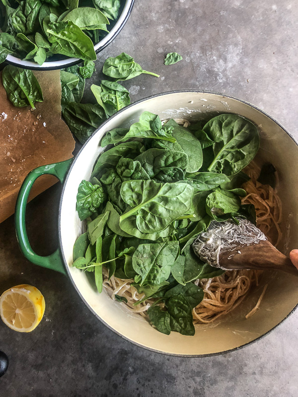 Creamy Goat Cheese and Spinach Pasta is a snap to put together on a weeknight. The sauce is made creamy with goat cheese and pasta water. Recipe on Shutterbean.com!