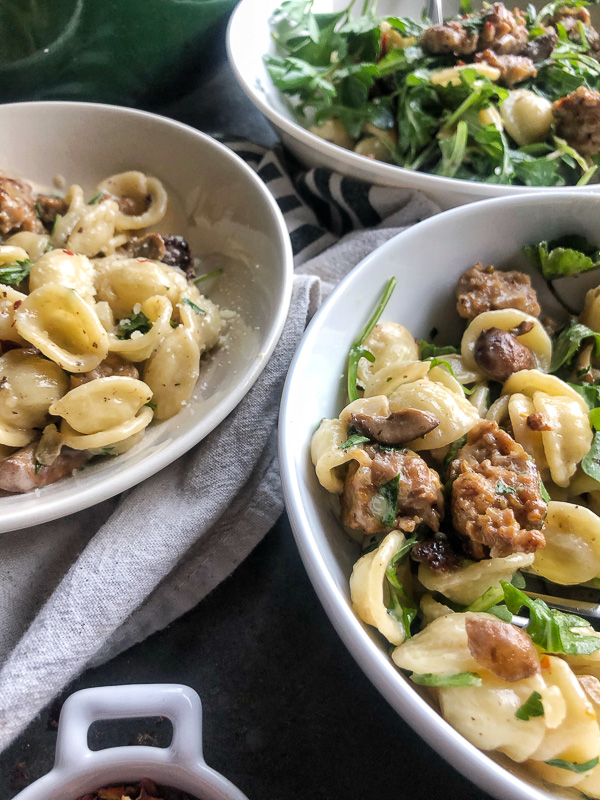 Creamy Mushroom Sausage Orecchiette is the ultimate comfort food. Make it for your guests! Find the recipe on Shutterbean.com