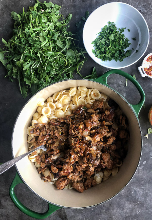 Creamy Mushroom Sausage Orecchiette is the ultimate comfort food. Make it for your guests! Find the recipe on Shutterbean.com