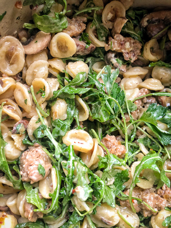 Creamy Mushroom Sausage Orecchiette is the ultimate comfort food. Make it for your guests! Find the recipe on Shutterbean.com