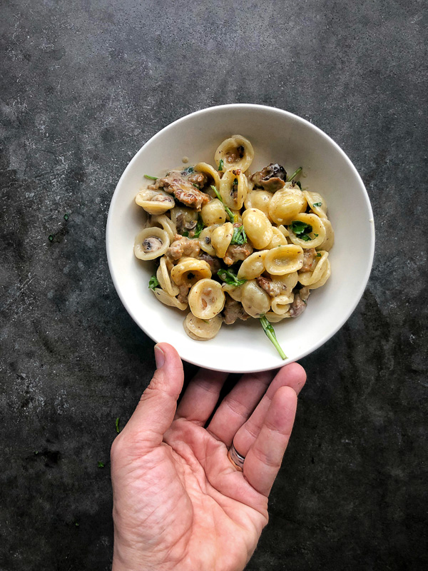 Creamy Mushroom Sausage Orecchiette is the ultimate comfort food. Make it for your guests! Find the recipe on Shutterbean.com