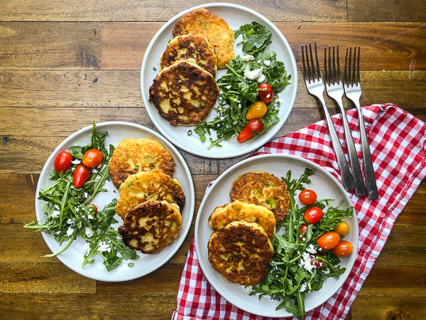 Sweet Corn Fritters with a salad makes for a healthy summer meal! Find the simple recipe on Shutterbean.com!