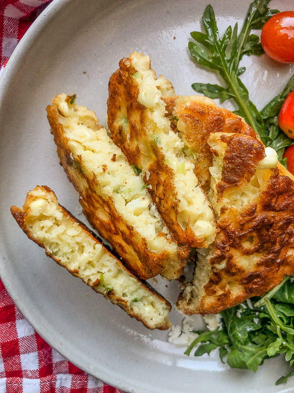 Sweet Corn Fritters with a salad makes for a healthy summer meal! Find the simple recipe on Shutterbean.com!