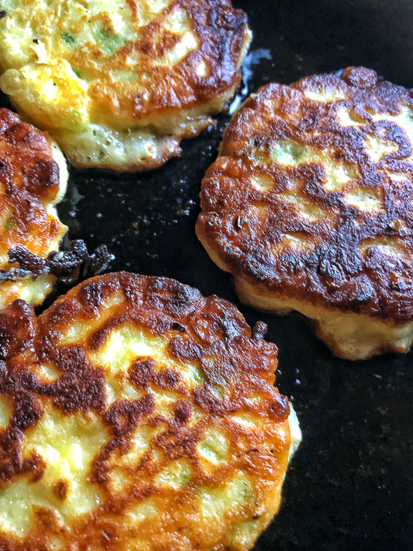 Sweet Corn Fritters with a salad makes for a healthy summer meal! Find the simple recipe on Shutterbean.com!