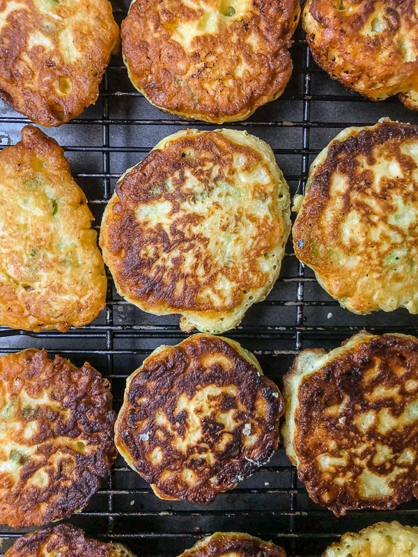 Sweet Corn Fritters with a salad makes for a healthy summer meal! Find the simple recipe on Shutterbean.com!