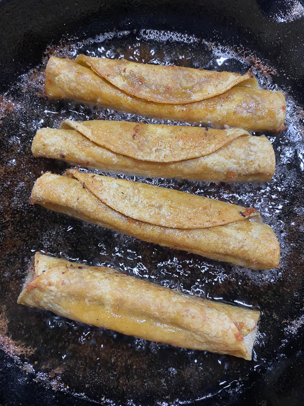 Bean and Cheese Taquitos are a simple vegetarian meal to whip up! Find the recipe on Shutterbean.com