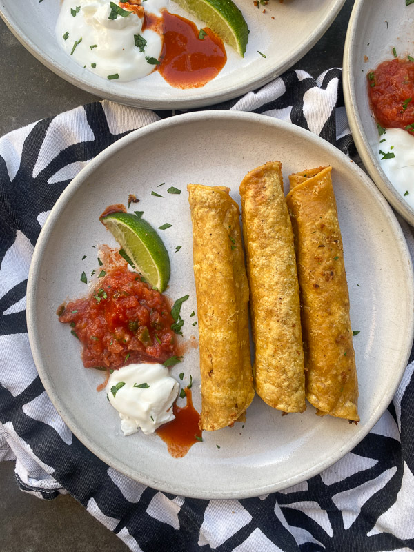 Bean and Cheese Taquitos are a simple vegetarian meal to whip up! Find the recipe on Shutterbean.com