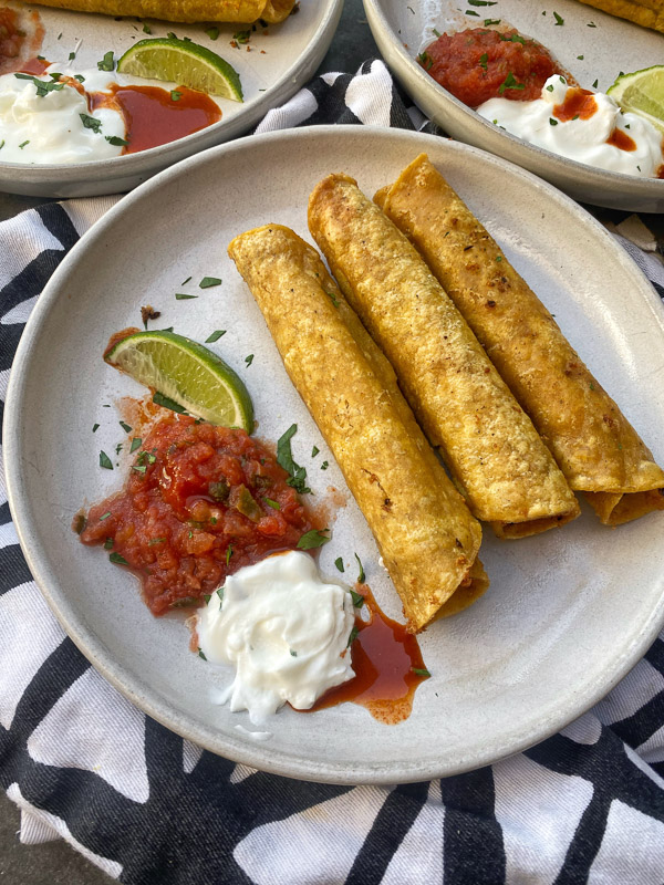 Bean and Cheese Taquitos are a simple vegetarian meal to whip up! Find the recipe on Shutterbean.com