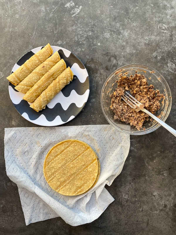 Bean and Cheese Taquitos are a simple vegetarian meal to whip up! Find the recipe on Shutterbean.com