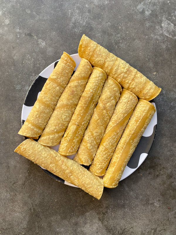 Bean and Cheese Taquitos are a simple vegetarian meal to whip up! Find the recipe on Shutterbean.com