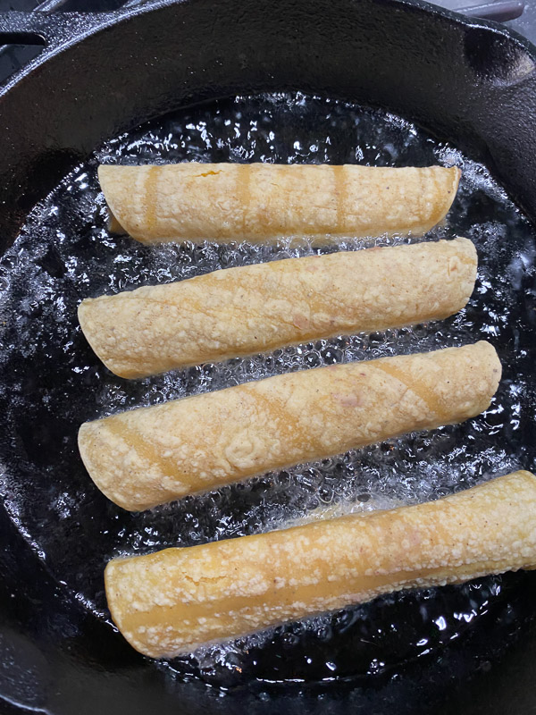 Bean and Cheese Taquitos are a simple vegetarian meal to whip up! Find the recipe on Shutterbean.com